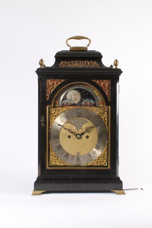 An English ebonized striking table clock James Smith London with moonphase