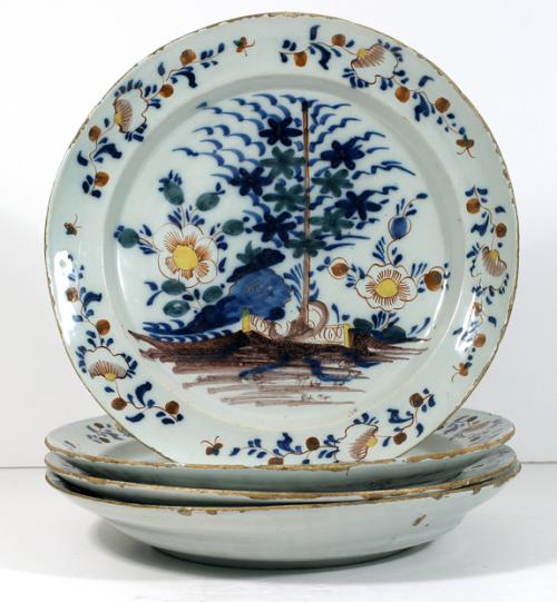 A Set of Four Polychrome Delft Chargers