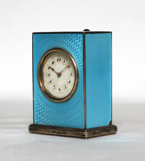 Elegant Swiss Miniature Clock covered with transparant blue enamel. JTC
