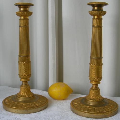 A PAIR OF FIRST EMPIRE CANDLESTICKS