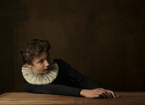 Boy with White Collar at Table