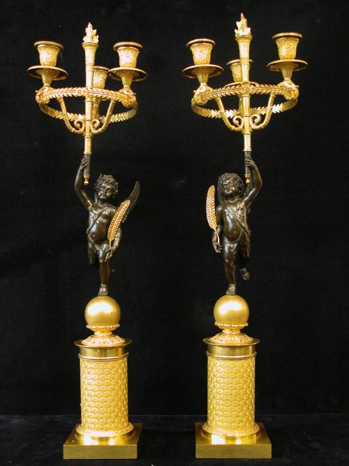 A Pair of Two French Empire Gilt and Patinated Bronze Three-Light Candelabra.<br>France, circa 1810.