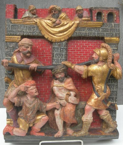 A POLYCHROME CARVED WOODEN RELIEF  1 of 2