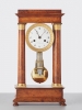 A French ‘Empire’ maple and gilt 4-column clock, circa 1830