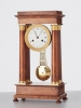 A French ‘Empire’ maple and gilt 4-column clock, circa 1830