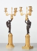 A pair of French gilt candlesticks with patinated bronze angels, circa 1820