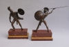 Two bronze statues on marble bases: Romulus and Titus Tatius