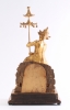 Een Oostenrijkse verguld houten figurale klok met dubbel mechaniek, omstreeks 1830