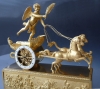 “Cupid’s Chariot”, a French Empire gilt bronze figural mantel clock, Le Roy,  Palais Royal à  Paris, c. 1810.