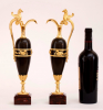 A pair of empire patinated bronze and fire gilded ewers, Circa 1810