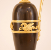 A pair of empire patinated bronze and fire gilded ewers, Circa 1810