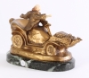 An Art Deco bronze marble and ivory sculpture of a car, circa 1920.