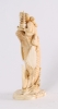 'Man on a Carp', a Japanese carved ivory sculpture, circa 1880