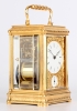A fine French engraved gilt brass gorge case travel clock with alarm by Drocourt, circa 1880.