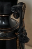 A fantastic black marble ‘retour de l’Egypt’ mantle clock with two side pieces.