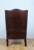 A very unusual and chic crocodile upholstered wing chair.