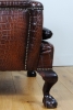A very unusual and chic crocodile upholstered wing chair.