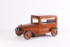 An Art Deco thuja burr model of a car with music box, circa 1930