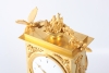 A lovely French Empire ormolu borne mantel clock with butterfly, circa 1800
