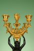A set of four large Empire candelabra