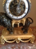 M175 Louis XVI mantel lion clock, with skeletonized clockwork, silver hands and frame on the bezel and striking on a silver bell