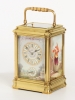 A French porcelain mounted gilt brass carriage alarm clock,circa 1880
