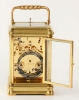 A French porcelain mounted gilt brass carriage alarm clock,circa 1880