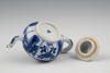 A miniature Chinese porcelain teapot.
