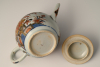 A Chinese porcelain Imari teapot with floral decor