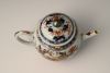 A Chinese porcelain Imari teapot with floral decor