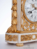 A fine French Louis XVI ormolu mounted marble borne mantel clock, Wolff Paris, circa 1770.