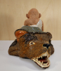 Carolein Smit, baby sitting on pillow on top of the head of a bear - Carolein Smit