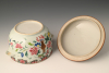 A Chinese porcelain Famille Rose lidded jar