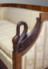 A mahogany Empire sofa with carved swans