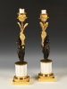 A pair of ormolu and patinated bronze candlesticks