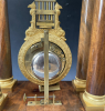 A French mahogany ormolu mounted portico mantel clock with oscillating movement, Empire ca. 1820-30.