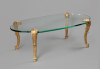A gilt bronze and glass coffee table – Signed P.E. Guerin New York