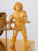 A French Empire gilt bronze mantel clock water seller, circa 1810