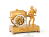 A French Empire gilt bronze mantel clock water seller, circa 1810