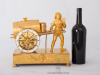 A French Empire gilt bronze mantel clock water seller, circa 1810