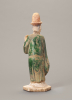 A Chinese green-glazed pottery figure of a tomb attendant