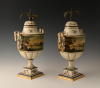 A pair of rare pewter chestnut vases