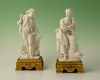 A set of two decorative biscuit-porcelain figures