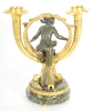 Een stel Franse verguld en gepatineerd bronzen kandelaars naar ontwerp van Alfons Giroux, omstreeks 1880
