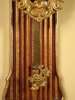 W30 Rack clock mounted on a shaped giltwood backboard.