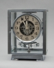 M115 Chrome  plated art deco J. L. Reutter four-glass Atmos clock