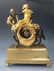 Superb gilt and patinated bronze sculptural mantel clock, 