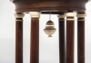 An unusual circular wooden temple dome pillar timepiece clock circa1830