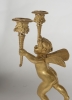 A pair of two armed empire ormolu candlestick with Cupids, Circa 1820