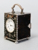 The small English tortoiseshell and silver carriage clock circa 1902